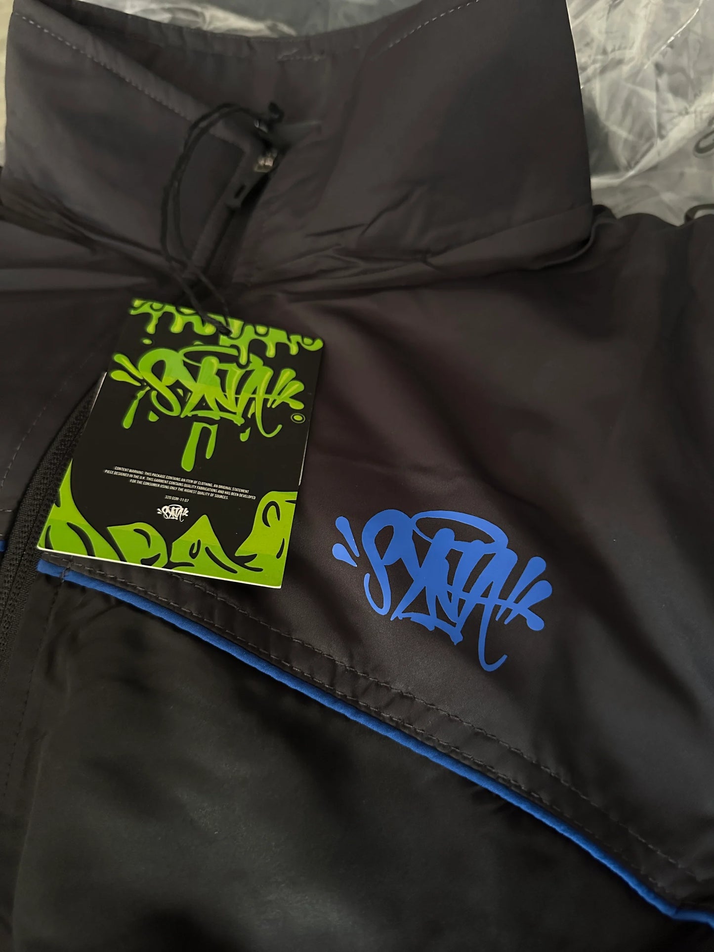 SYNAWORLD SYNA LOGO MELLÉNYES TRÉNINGRUHA - SZÜRKE/FEKETE/KOBALT